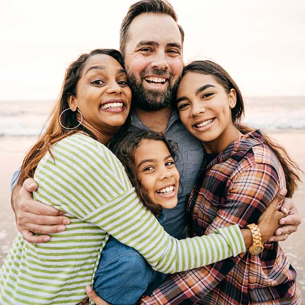 Smiling couple with two children